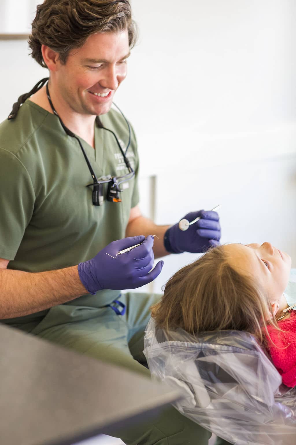 Dr. Diebold examining child's teeth