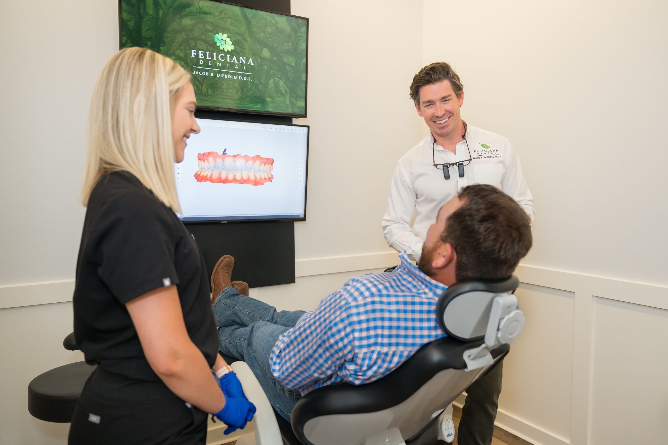 Dr. Diebold showing client dental imaging